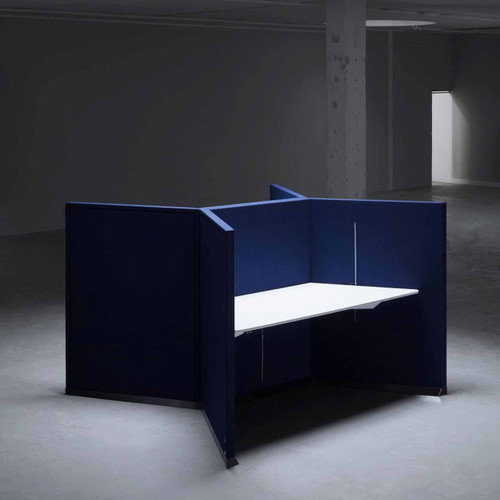 The Hive workstation has been designed to make the most of challenging layouts -  dark blue and white tabletop -  side view - in room.