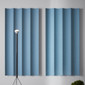 The Abstracta XL Sound Absorbing Walls are a great fit for large and noisy rooms - convex and concave light blue walls.