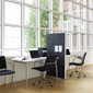 The Alumi acoustic screen adds a playful touch to space partitioning - circle pattern black panel - front view - in office.