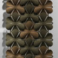 The Abstracta Airbloom Hanging Screen refresh the office environment by the flower shaped like panels - light and dark brown panels - front view - in office.