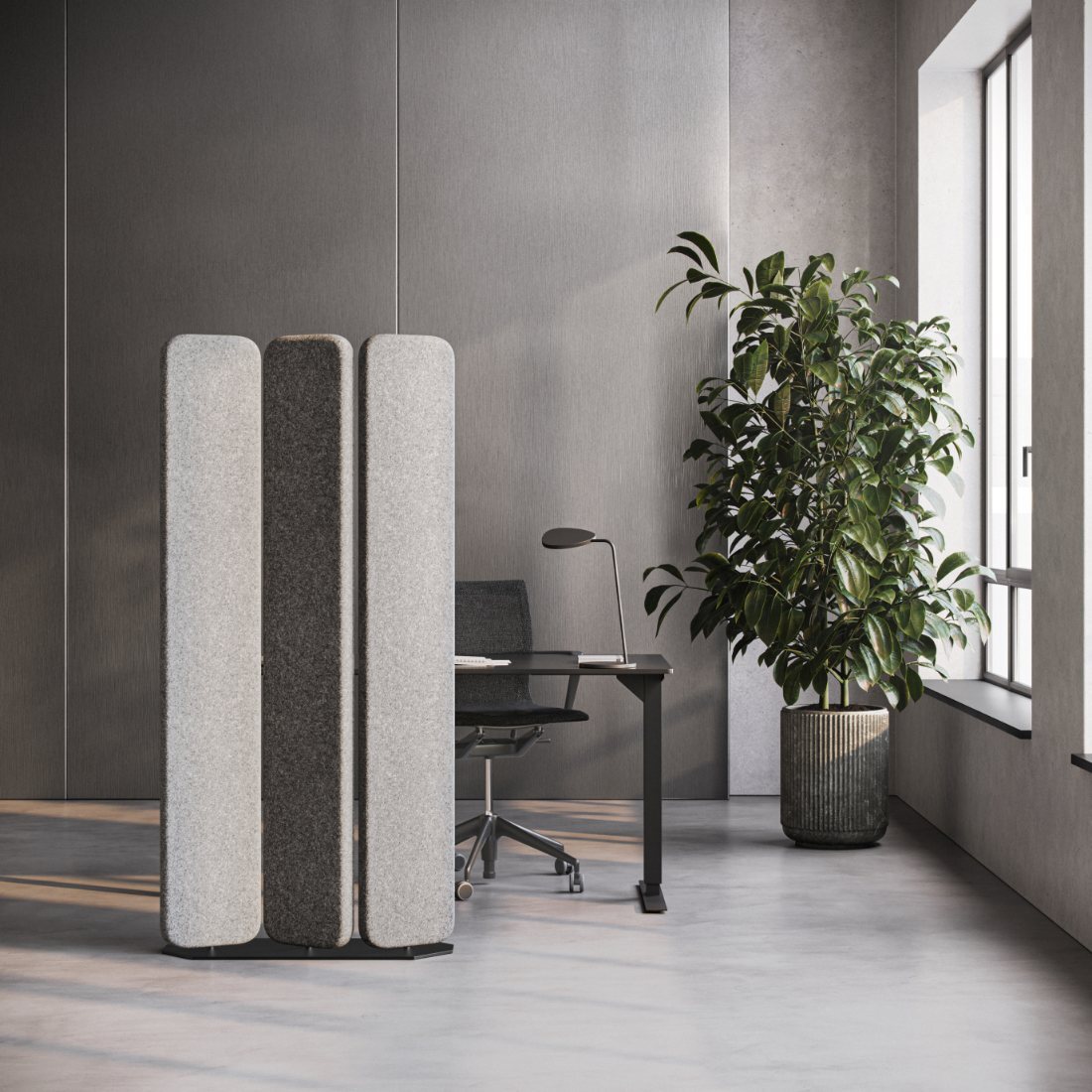 Grey felt acoustic screens beside a desk