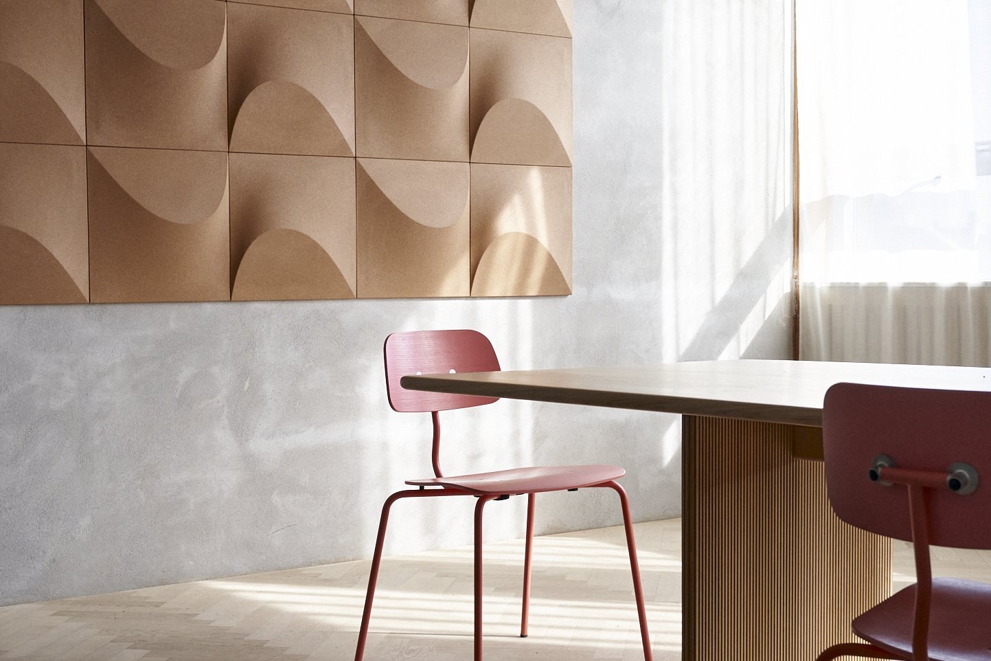Sculpted acoustic panels on a meeting room wall