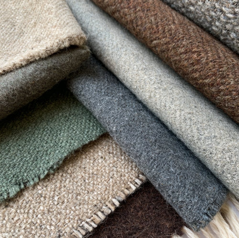 Camira fabric swatches in grey, green and brown