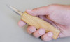 Beaver Craft Whittling Knife showing the size of the knife compared to a hand.