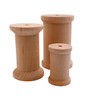 The three basswood spools are in a group to compare the small, medium, and large.