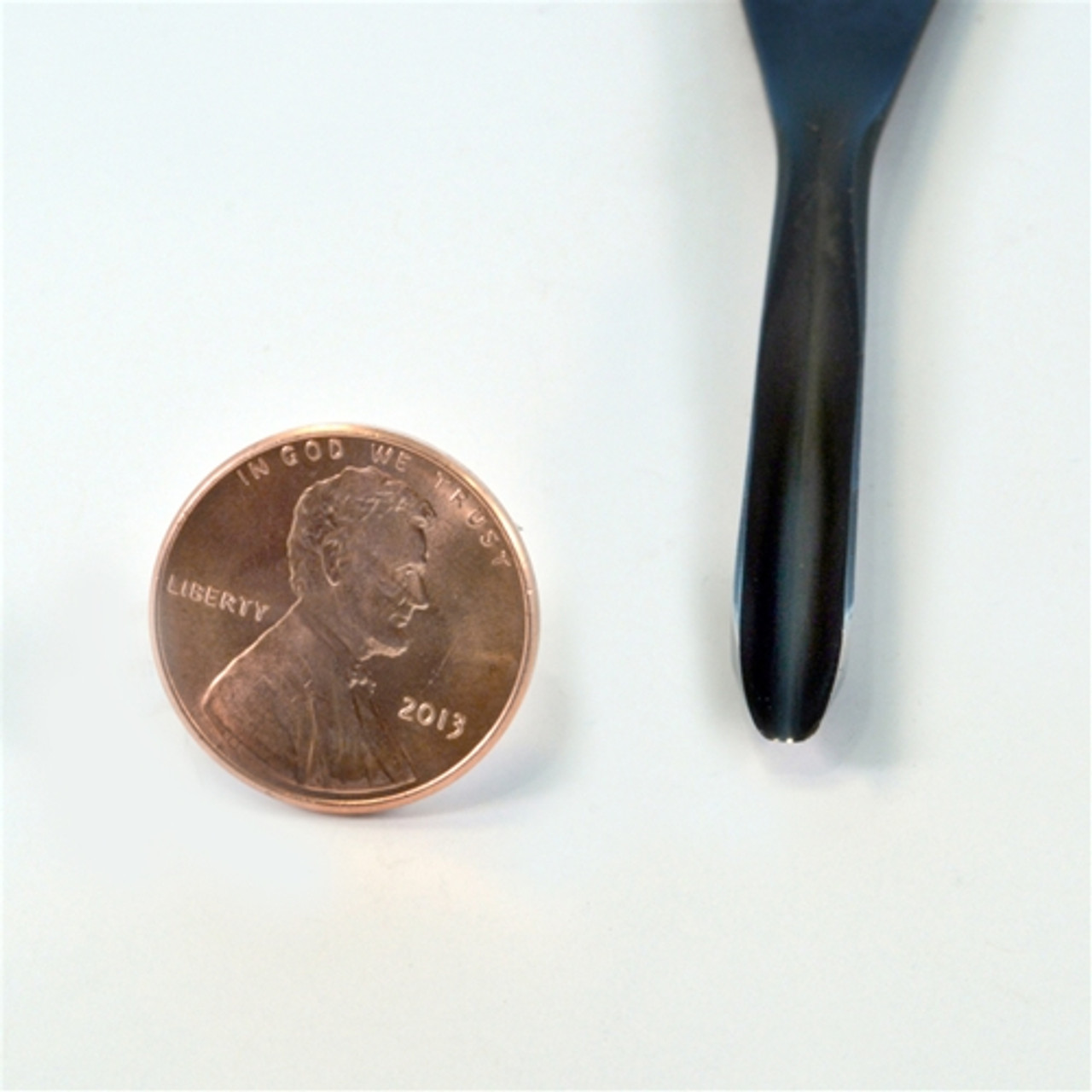 Flexcut FR725 Palm  #11 x 3/16"Thumbnail Gouge next to a penny to compare the size of the bevel along the cutting edge.