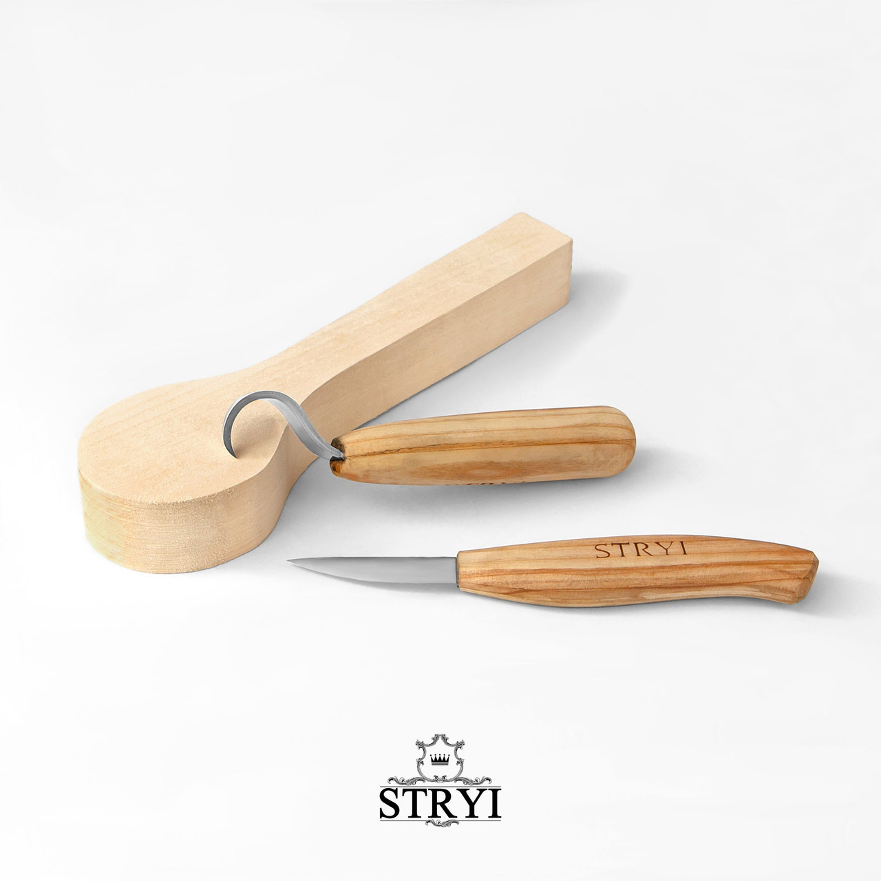 The individual spoon carving tools are included in the Stryi Spoon Carver's 2 Piece Beginner Set with the spoon cutout.  The tools show their short wood handles and steel cutting edges.