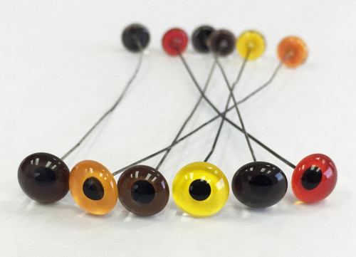 Medium Grade Glass Eyes shown from left in Medium Brown, Straw, Hazel, Yellow, Dark Brown & Red.