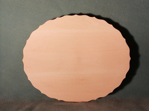 Basswood scalloped oval plate showing the face with the scalloped edges and flat face.