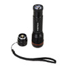 High-resolution image of the Portwest PA75 USB rechargeable flashlight, black with a red accent ring. Highlights its compact design and powerful LED lens for adjustable focus.