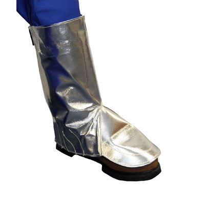 The image showcases the Stanco AR27 spring-type legging worn over a work boot and blue safety trousers. The highly reflective Aluminized P.B.I.® material covers the entire shin and extends forward in a wide flare to shield the laces and bridge of the foot. The smooth, vertical design highlights the spring-fit mechanism that keeps the legging upright and secure without the use of external straps.