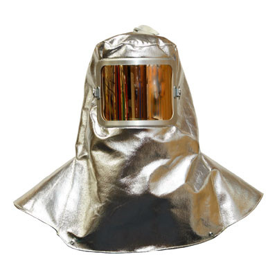 The image displays the Stanco AK710 hood, showcasing its highly reflective aluminized surface and wide-bib design. The prominent 7" x 11" gold lens window is shown at the center, highlighting the specialized filtration needed for viewing high-heat sources. The shoulder-length drape demonstrates how the hood provides comprehensive coverage for the head, neck, and upper chest.