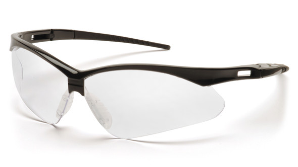 A 3/4 front view of the Pyramex PMXTREME SB6310SP safety glasses, featuring a sleek black frame and a high-clarity clear lens. The image highlights the aggressive 10-base curve panoramic lens design, which provides an unobstructed field of vision and maximum wraparound protection. Key ergonomic details visible include the ventilated straight-back temples for airflow and the built-in rubber nose piece designed for a secure, non-slip fit. Weighing only 23.1 grams, these glasses are ANSI Z87.1-2020 high-impact certified and offer 99% protection against harmful UV rays.