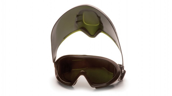 Pyramex Capstone Shield IR 5.0 Goggle (GG504TSHIELDIR5) shown with the removable face shield fully engaged. This dark green, IR 5.0 safety goggle provides ANSI D3/D4 chemical splash, dust, and full face protection for heavy duty furnace, molten metal, and brazing applications.