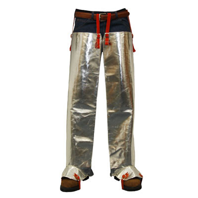 The image shows the Stanco AR506 leggings worn over standard work denim, highlighting the high-reflectivity of the aluminized P.B.I. surface. The belt fastener straps are visible at the waist, and the protective boot flares at the bottom demonstrate how the leggings integrate with safety footwear to prevent sparks or splash from entering the boots.