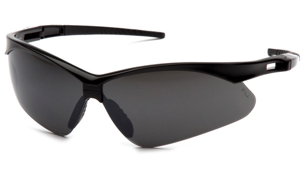 A crisp 3/4 view of the Pyramex PMXTREME SB6376SP safety eyewear, featuring a specialized smoke green mirror lens and a durable black nylon frame. The smoke green mirror coating is specifically designed for bright outdoor conditions, providing significant glare reduction and a professional look while ensuring 99% protection against UVA, UVB, and UVC rays. The design utilizes a 10-base curve panoramic lens to provide maximum wraparound protection and an unobstructed field of vision. For enhanced comfort, the glasses feature ventilated straight-back temples for consistent airflow and a built-in rubber nose piece for a secure, non-slip fit. This lightweight 23.1-gram model is ANSI Z87.1-2020 high-impact certified and includes the signature black lanyard cord for added security on the job.