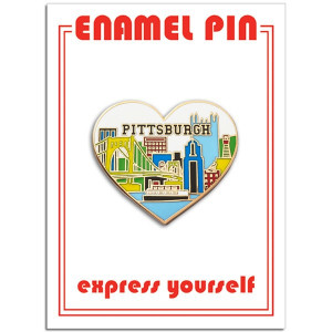 image of heart shaped enamel pin with a pittsburgh skyline placed on a white card with red font. image of heart shaped enamel pin with a pittsburgh skyline placed on a white card with red font.