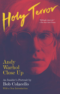 Image of the cover of a book with Andy Warhol's face on it titled Holy Terror, printed in yellow at the top of the book cover.