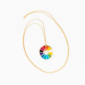A rainbow color wheel on a gold chain A rainbow color wheel on a gold chain