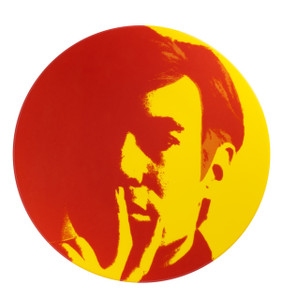 A plate with a portrait of Andy Warhol with his hand to his face, in red and yellow. A plate with a portrait of Andy Warhol with his hand to his face, in red and yellow.