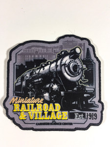 This image shows an iron on patch with an irregular shape showing the Miniature Railroad and Village image in black and beige, with Carnegie Science Center logo.