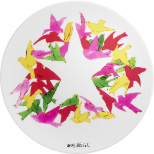 A plate with a drawing of birds arranged around a start shape in the center. A plate with a drawing of birds arranged around a start shape in the center.