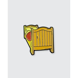 Enamel pin in the shape of a bed shown in foreshortened perspective Enamel pin in the shape of a bed shown in foreshortened perspective