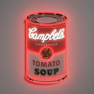 A lit soup can artwork hanging on a wall
