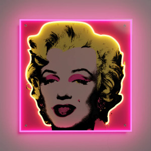 A Pink Marilyn lit with LED neon hanging on a wall A Pink Marilyn lit with LED neon hanging on a wall