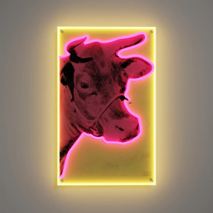 A Cow artwork lit with LED neon hanging on a wall A Cow artwork lit with LED neon hanging on a wall