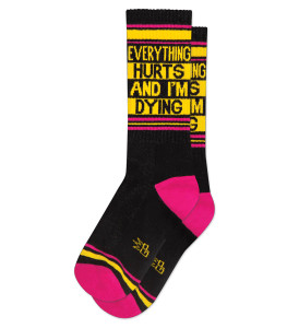 A pair of black socks with pink heal and toes, text: everything hurts and i'm dying. A pair of black socks with pink heal and toes, text: everything hurts and i'm dying.