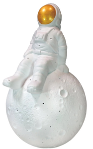 Image of a space-suited astronaut sitting on a mini moon, against a white background Image of a space-suited astronaut sitting on a mini moon, against a white background