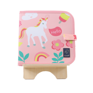 Pink book featuring a unicorn with a speech bubble saying "Hello", flowers, a cloud, leaves, a popsicle, and a rainbow. Pink book featuring a unicorn with a speech bubble saying "Hello", flowers, a cloud, leaves, a popsicle, and a rainbow.