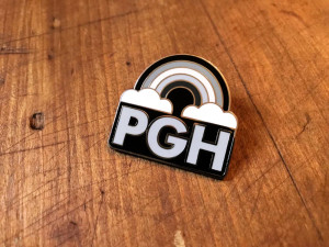 Enamel pin of grey rainbow, text: PGH Enamel pin of grey rainbow, text: PGH