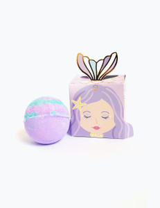 Purple box with purple-haired mermaid and pop-up tail next to purple and blue bath balm. Purple box with purple-haired mermaid and pop-up tail next to purple and blue bath balm.