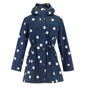 Navy raincoat covered with white polka dots. Navy raincoat covered with white polka dots.