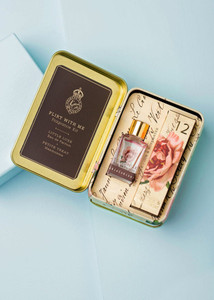 open tin with mini perfume & lotion box inside open tin with mini perfume & lotion box inside