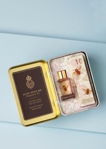 small metal tin with mini bottle of perfume and mini box of lotion inside, image of 2 bees printed on box small metal tin with mini bottle of perfume and mini box of lotion inside, image of 2 bees printed on box