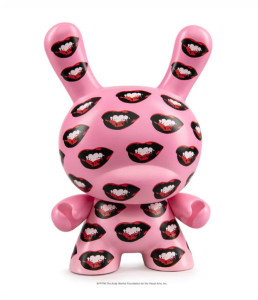 A pink vinyl toy with all-over red lip pattern