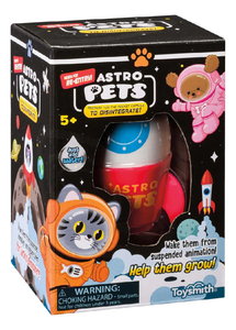 Image of Astro Pets rocket capsule in its box, with artwork of .cats and dogs in space suits