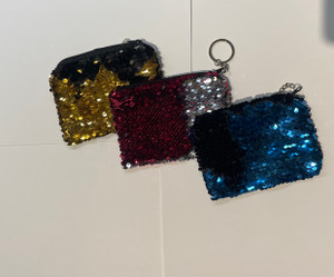 three sequin bags side by side