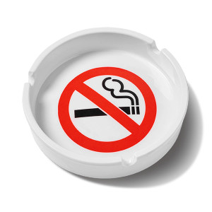 Round white ashtray with no smoking imagery in the middle. Round white ashtray with no smoking imagery in the middle.