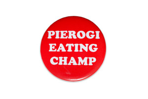 Red round button, white text" pierogi eating champ".