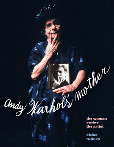 Book cover, photograph of Warhol mother holding a black and white portrait of Warhol with his hand on face.