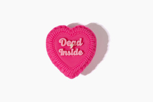 hot pink vintage heart-shaped cake candle, light pink script text says DEAD INSIDE. hot pink vintage heart-shaped cake candle, light pink script text says DEAD INSIDE.