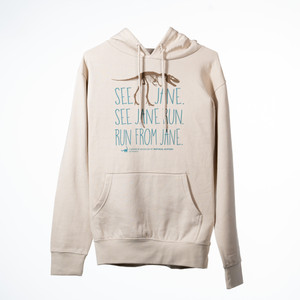 hoodie is a bone/cream color with a dark brown 2D image of a T.Rex Fossil and the words "see jane, see jane run, run from jane" written in blue/green text in 3 horizontal lines