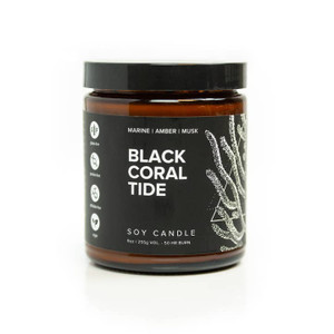 candle in dark brown glass with black lid. has a black wrap with "black coral tide" printed on it and a drawing of white coral on the right hand side candle in dark brown glass with black lid. has a black wrap with "black coral tide" printed on it and a drawing of white coral on the right hand side