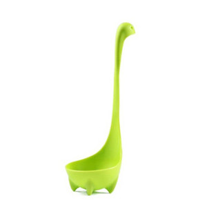 green ladle with 4 small feet and a handle with a small curve at the top and 2 eyes resembling a long neck dinosaur green ladle with 4 small feet and a handle with a small curve at the top and 2 eyes resembling a long neck dinosaur