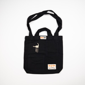 tote laid flat with both sizes of handles out and the CMNH logo printed in the upper left corner in white
