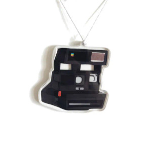 Acrylic ornament, image of a black instant photo camera. Acrylic ornament, image of a black instant photo camera.
